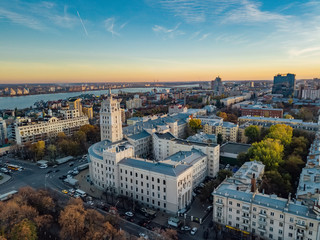 Fototapeta na wymiar Evening Voronezh. Sunset. South-East Railway Administration Building and Revolution prospect. Aerial view from drone