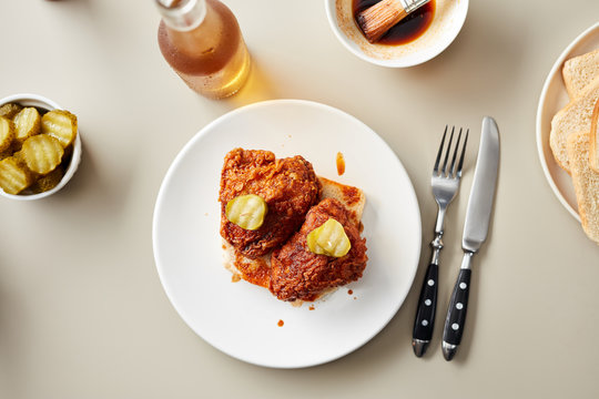 Ready-to-eat chicken breasts on slice of bread with pickles on t