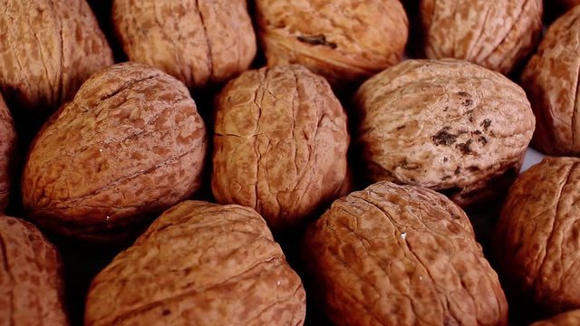Walnut texture. Brown big whole walnuts as background. walnut nuts pattern close up photo.