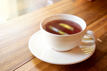 Closeup of cup of tea on vintage wooden background