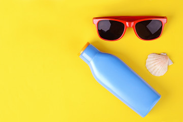Top view of sunglasses, shells and starfish