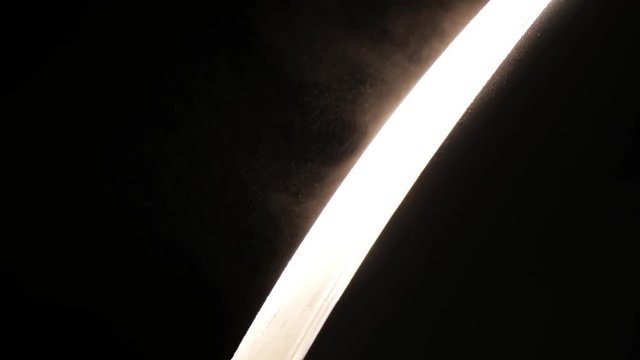 Dust Particles Flowing in Bright Light Black Background