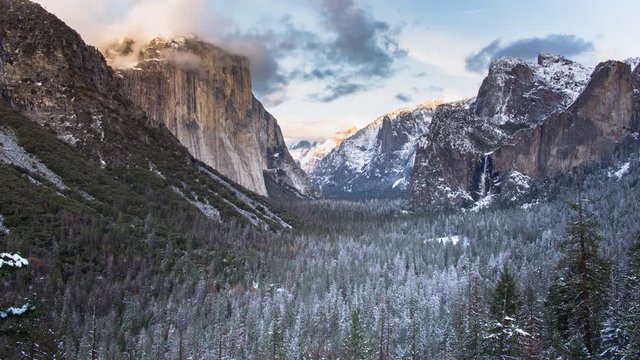 Yosemite Valley Panoramic Winter Sunset with Low Clouds on El Capitan and a Vibrant Firefall Red Sunburst at the end.