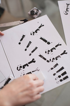 Close up of anonymous hands making homemade rubber stamps