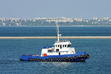 Tugboat in harbor quayside