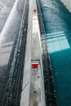 Sidewalk with restricting fence