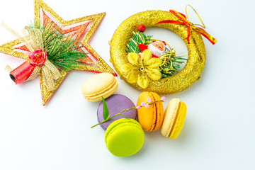 Colorful french macarons on white background.