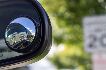 Close up of a blind spot mirror on the passenger side
