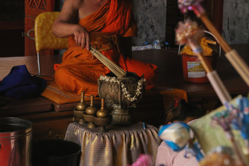 Monk give blessed water for people at Doi Suthep, Chiang Mai, Thailand