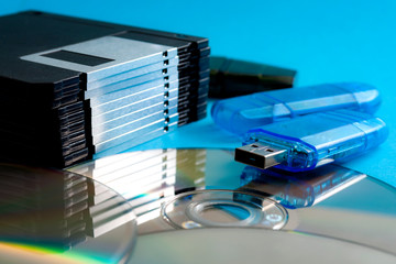 Evolution of data storage technologies and vintage technology concept with close up on a stack of...