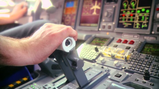 Pilot push thrust lever handle for takeoff a plane in the cockpit slowmotion