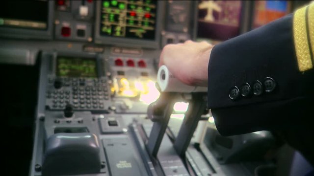 Pilot push thrust lever handle for takeoff a plane in the cockpit slowmotion