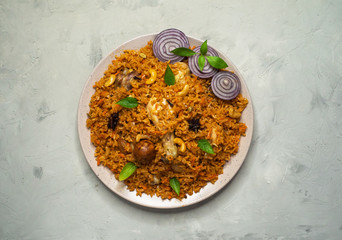 Homemade chicken Biryani. Arabic traditional food bowls kabsa with meat. Top view. 
