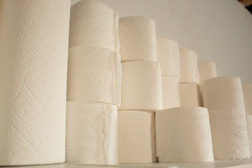 stacks of toilet paper and paper towels