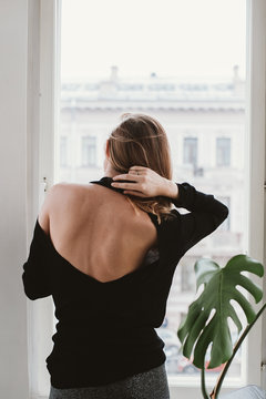 Young woman fixing her hair