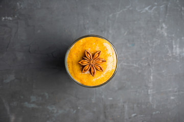 Fresh persimmon smoothie with banana and spices. Selective focus. Shallow depth of field.