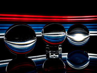 Red, White, and Blue Horizontal Stripes Create a Reflection in the Lensballs