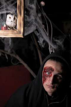 Teenager boy looking at camera at Halloween