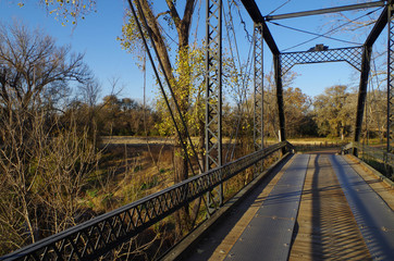 Fototapeta premium Newly renovated historic Piano Bridge in Dubina, Texas - erected 1885. One of the last remaining iron bridges in Texas
