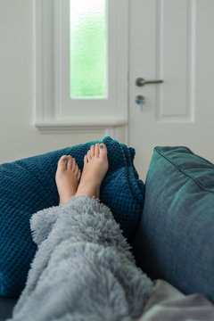 young woman's feet on sofa
