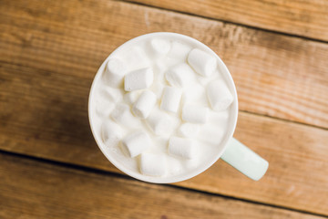 Sweet hot chocolate in mug. Christmas drink with marshmallow. Selective focus. Shallow depth of field. 