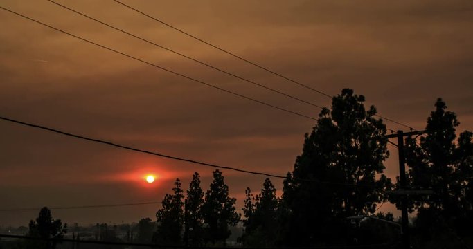 Sunset behind smoky sky from California Wildfires