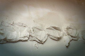 Renovation at home. Plasterer spreading plaster on wall. Who plaster wall plaster master.