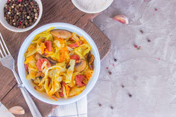 Bigos - stewed cabbage with carrots , smoked sausages and mushrooms, traditional dish of polish cuisine