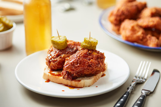 Delicious sandwich with fried chicken and pickles.