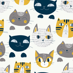 Cute cats muzzles seamless pattern. Artistic nursery background.