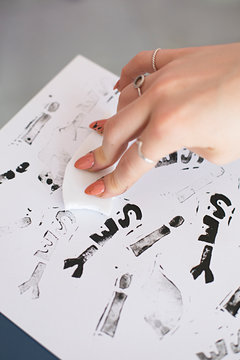 Close up of anonymous hands making homemade rubber stamps