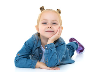 Little girl lies on the floor