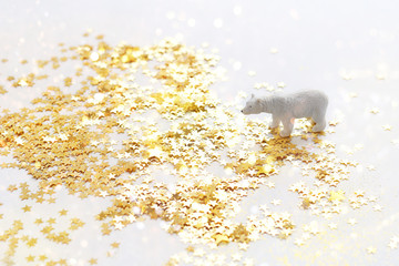 New year still life of toy bear. toy bear and the stars glitter. white polar bear. winter time, holiday season, new year, Christmas. soft focus
