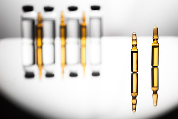 Group of ampoules with a transparent medicine in medical laboratory