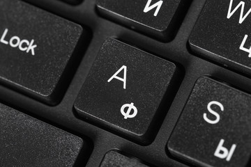 Black laptop keyboard close up