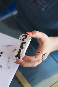 Close up of anonymous hands making homemade rubber stamps