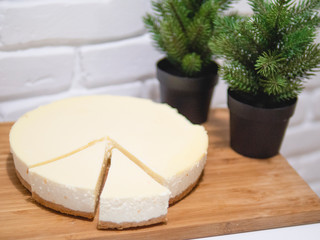 Homemade cheesecake with fresh strawberries and mint for dessert - healthy organic summer dessert pie cheesecake. Vanilla Cheese Cake.