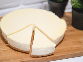 Homemade cheesecake with fresh strawberries and mint for dessert - healthy organic summer dessert pie cheesecake. Vanilla Cheese Cake.