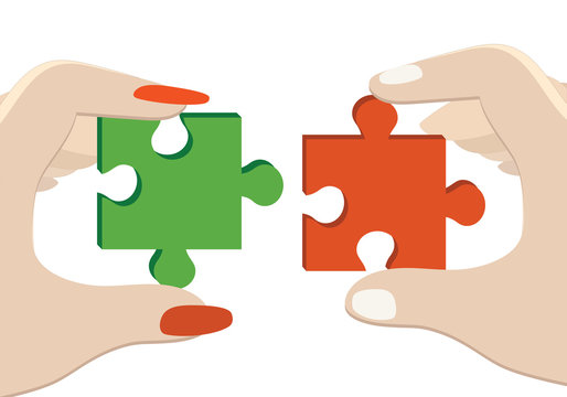  Hands of woman and man connecting jigsaw puzzle .
Business partnership concept. 