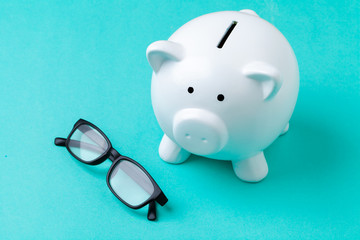 Pink piggy bank with glasses © NewFabrika