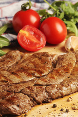 A beef steak well done with vegetables