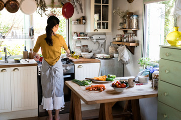 Japanese woman cooking in a countryside kitchen