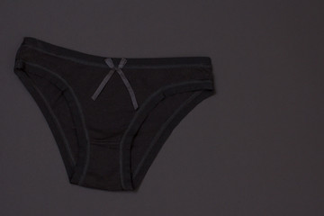 Beautiful women's cotton panties on black background.