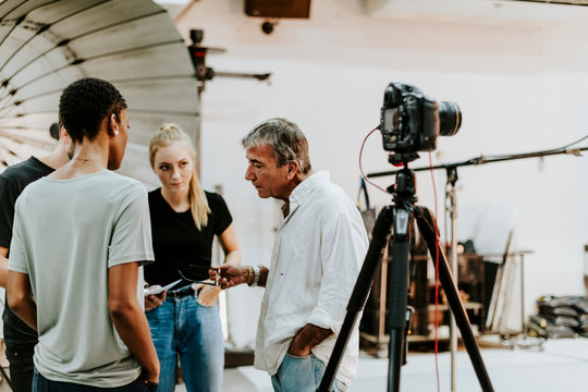 Photographer Directing His Shoot Team