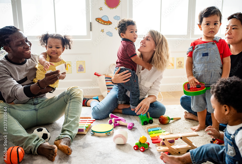 Wall mural diverse children enjoying playing with toys