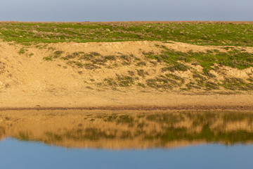 Fototapeta na wymiar Lake in the steppe of Kazakhstan in the spring