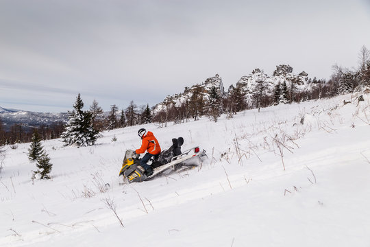 Athlete on a snowmobile.