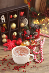 Christmas sweets and cocoa (coffee) Christmas decor on wooden background. Christmas and new year still life. bright colors, soft focus