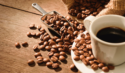 A shot of espresso with roasted coffee bean
