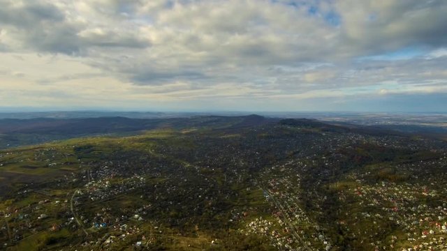 Quickly running clouds casting shadows on the land. Stabilized timelapse quadcopter shot at 620 meters above the ground. FullHD 1080p.